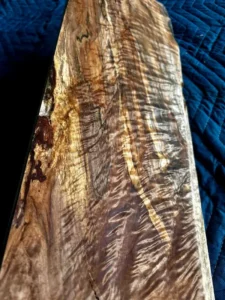 Cut section of maple board with dramatic curl and shimmer