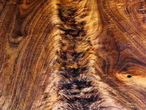 Close-up of rare walnut crotch figure on a custom bespoke vanity desktop.