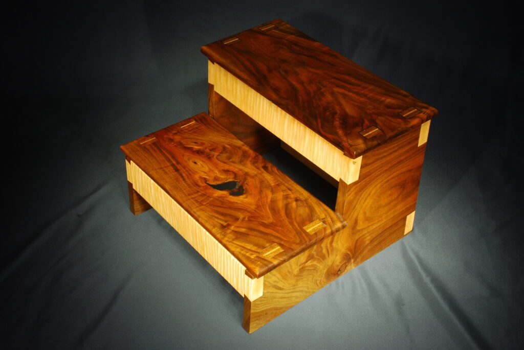 Highly figured Bastogne Walnut step stool with black epoxy