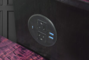 Recessed power hub in desk cabinet
