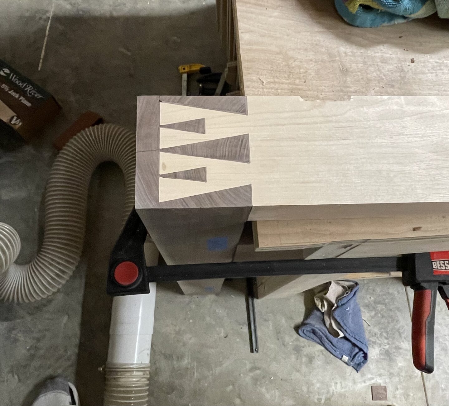 Close-up of a large houndstooth dovetail joint used in a custom hardwood workbench.