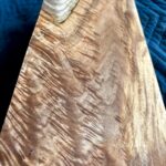 Tight shot of the back side of maple board with dramatic curl and shimmer