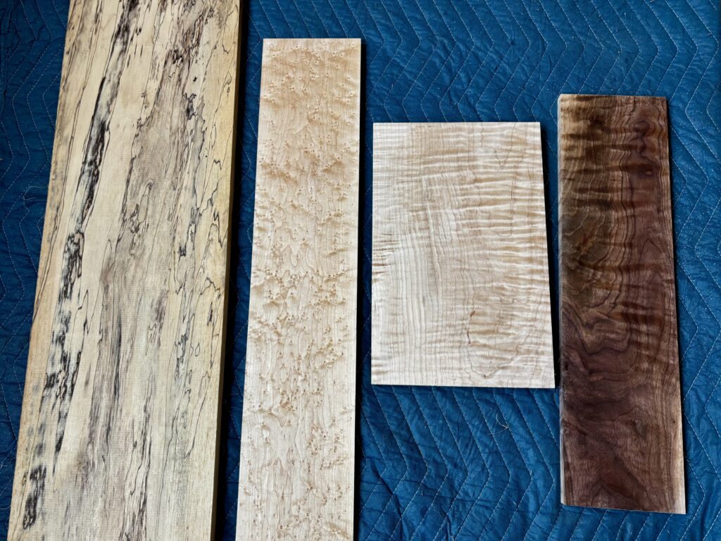 Examples of spalted maple, birdseye maple, curly maple, and figured walnut