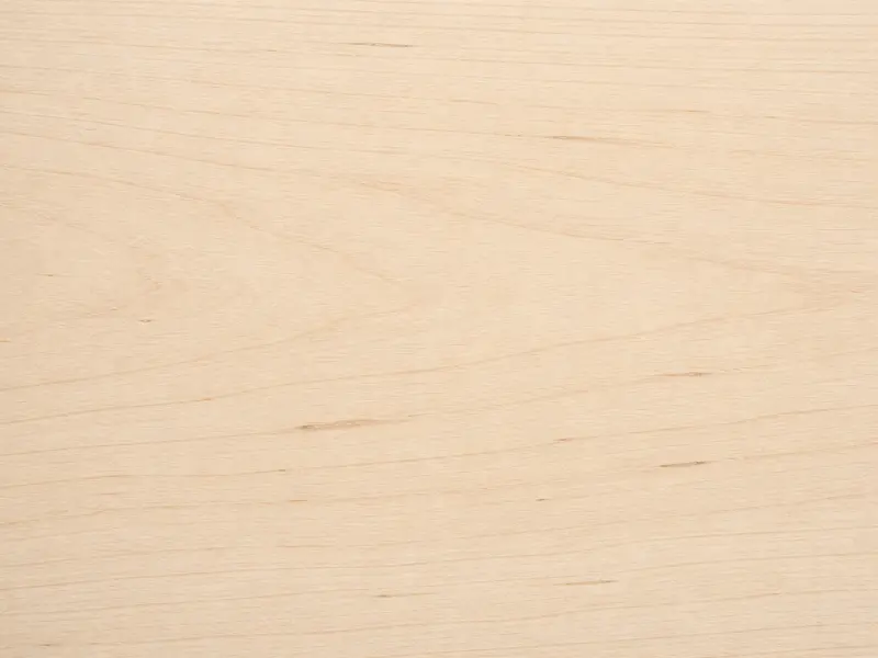 Basswood lumber surface with pale cream color and fine, subtle grain.