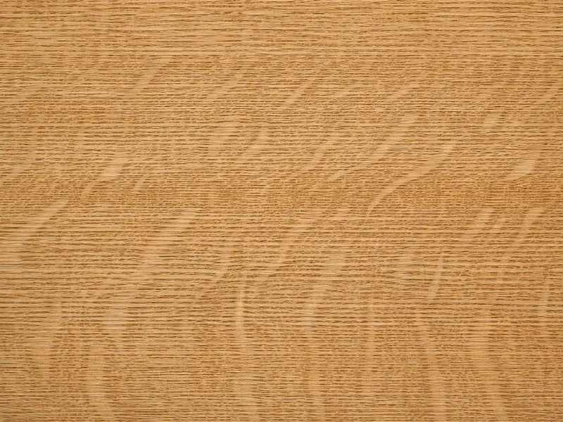 Quarter sawn white oak wood grain with visible ray fleck and straight vertical grain.